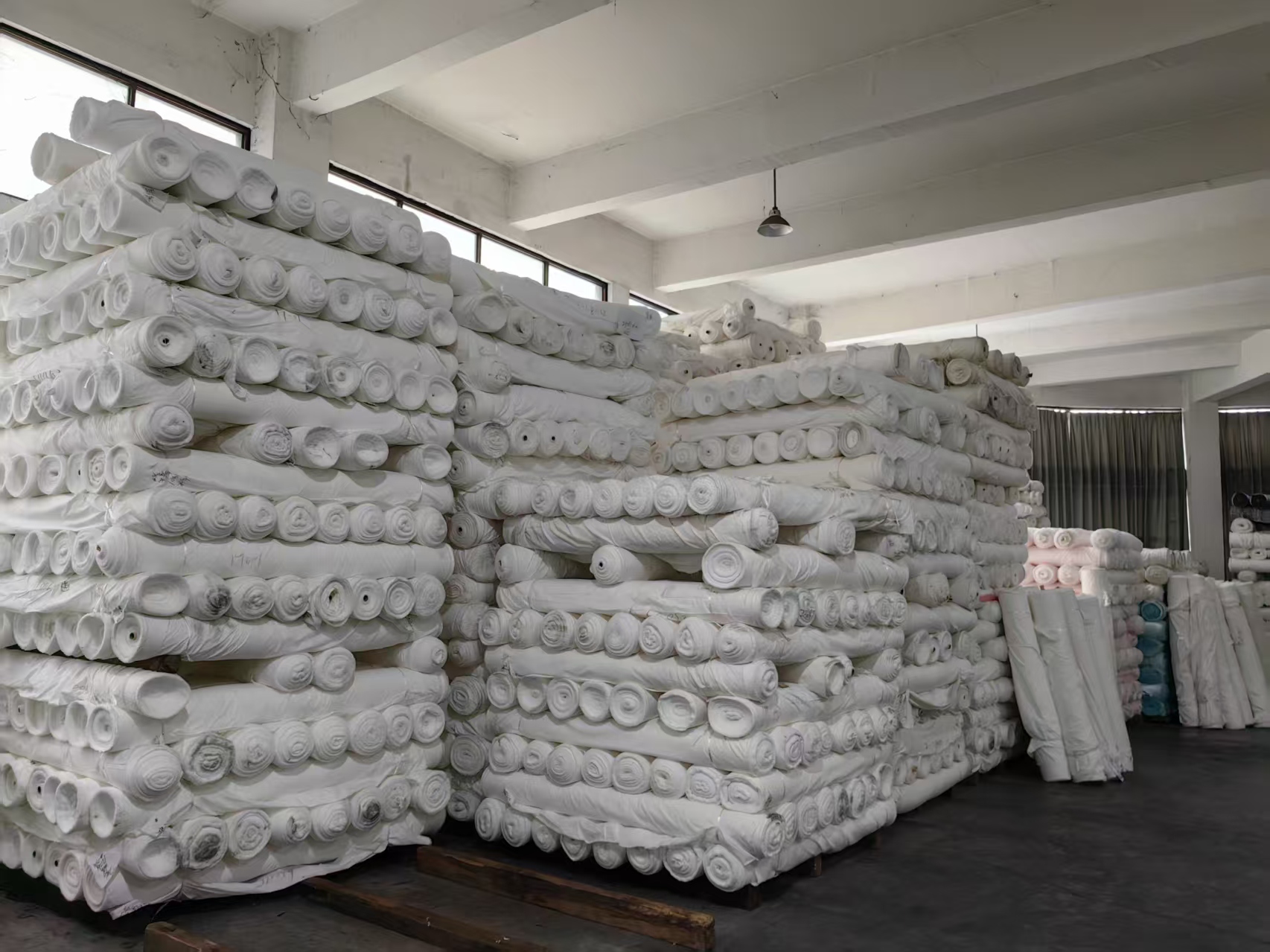 Rows of grey fabric reserves at Fuxing Textile