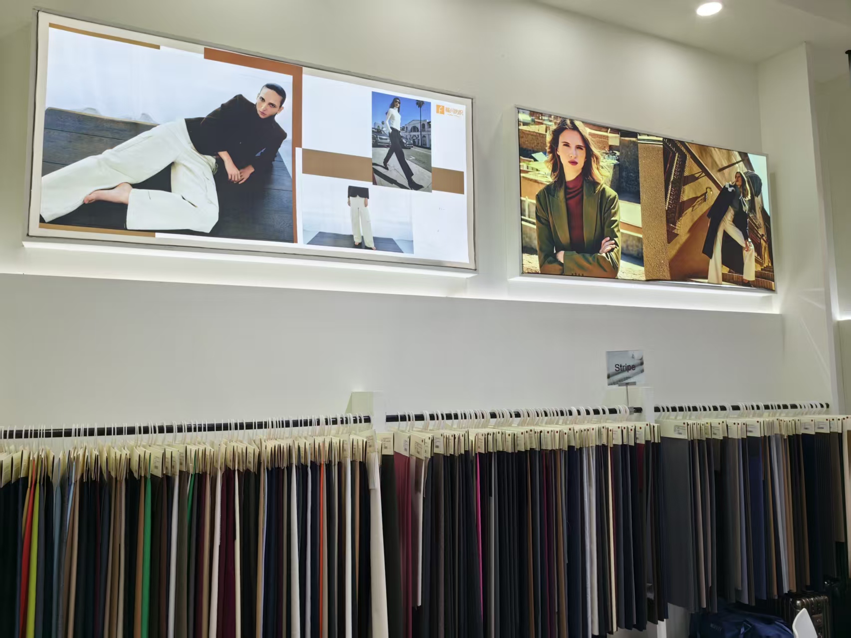 Vest and trouser rack inside the Fuxing Textile booth