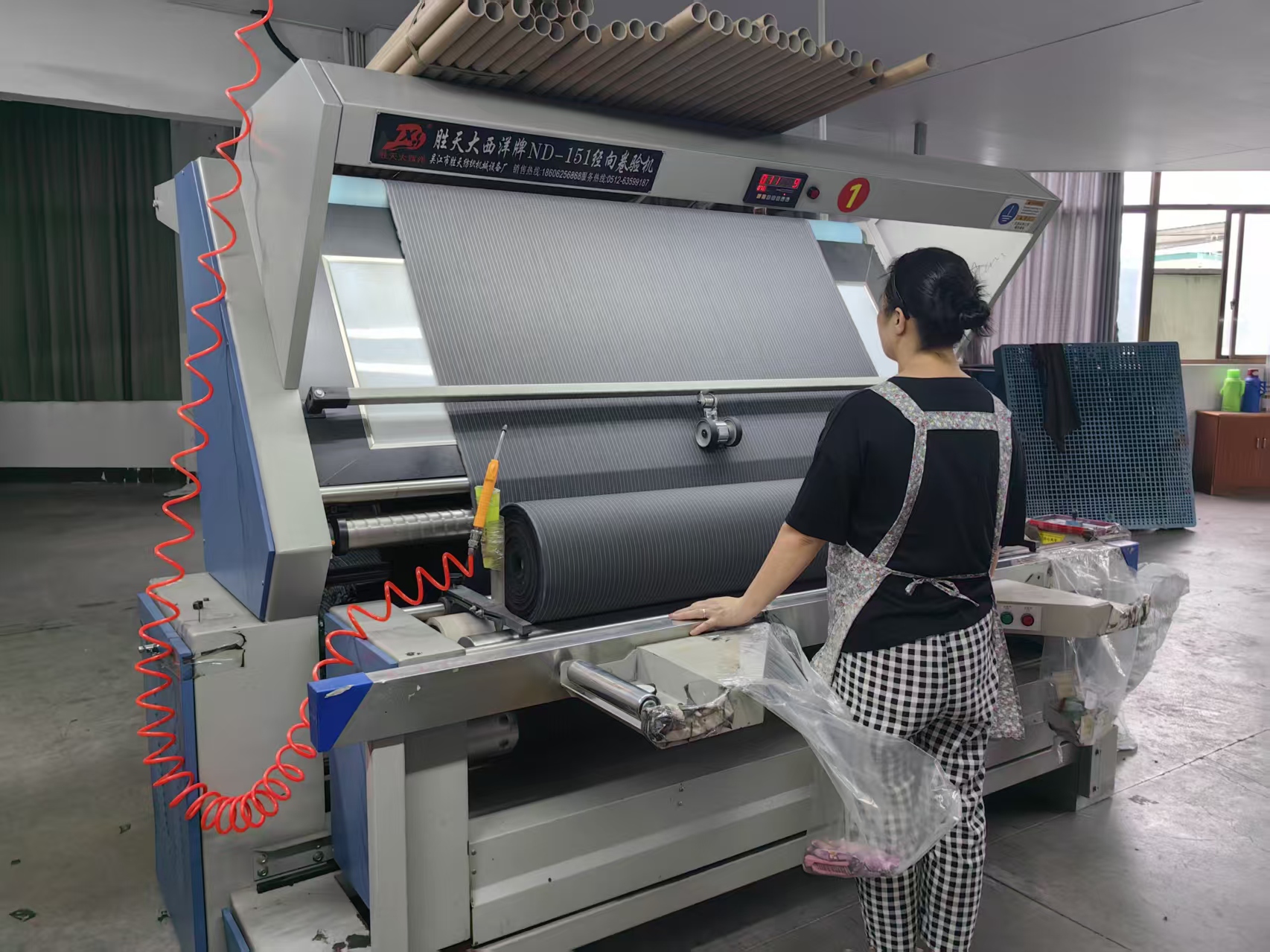Fuxing Textile finished goods warehouse with fabric rolls sorted and ready to ship