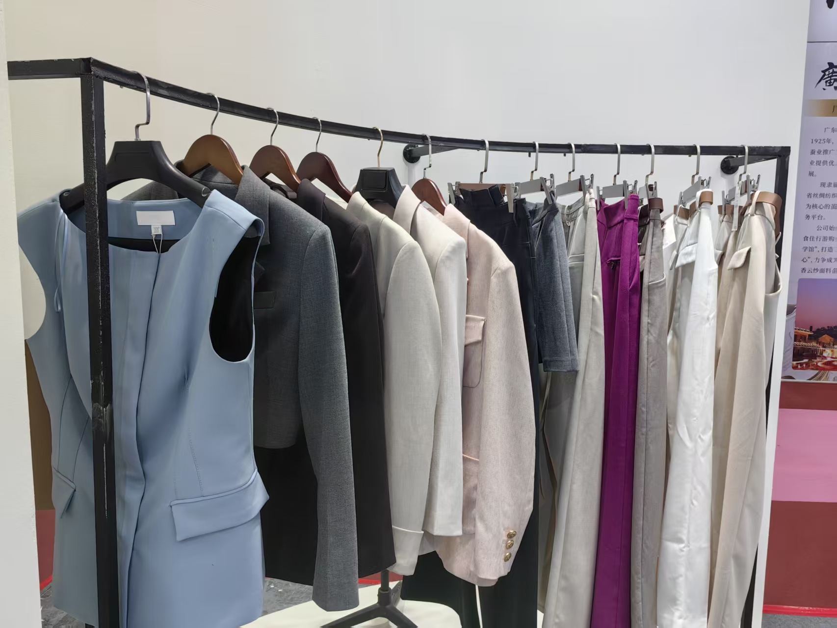 Long fabric rack showing suiting colorways